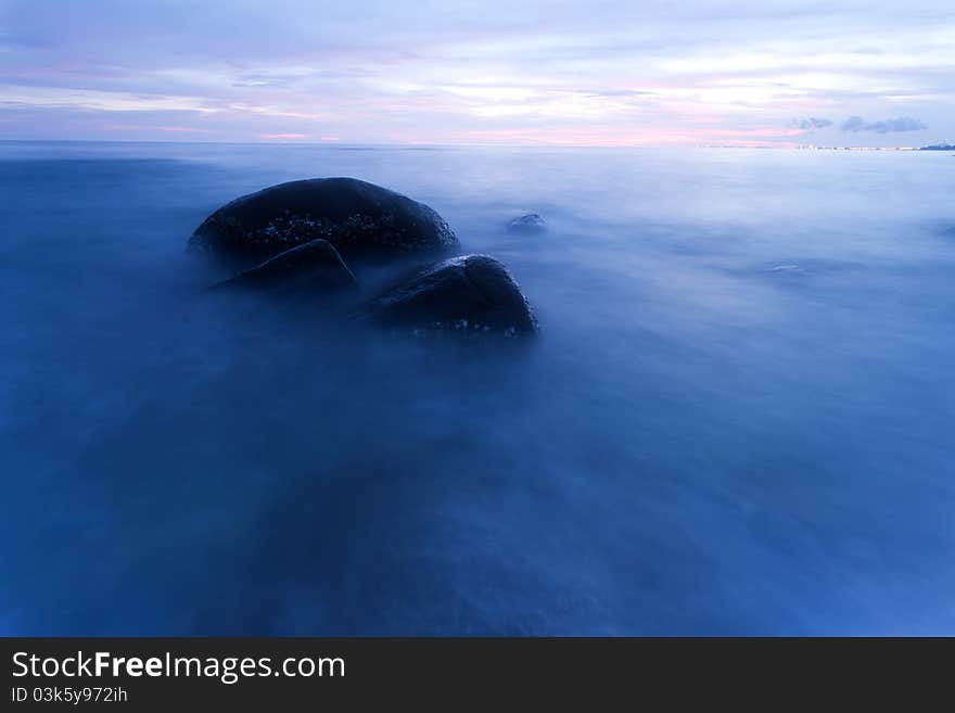 Sea and rock at the sunset. Nature composition. Sea and rock at the sunset. Nature composition.