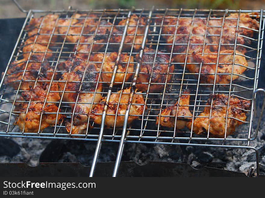 Preparing touristy food on the barbecue grate. Preparing touristy food on the barbecue grate