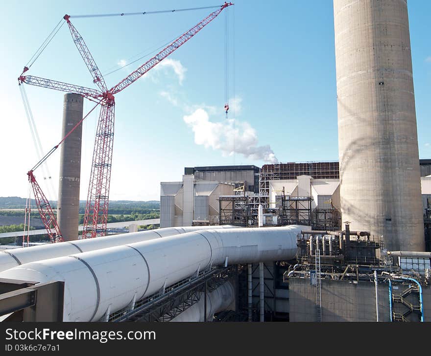 Coal fired power station with crane on site for maintenance projects