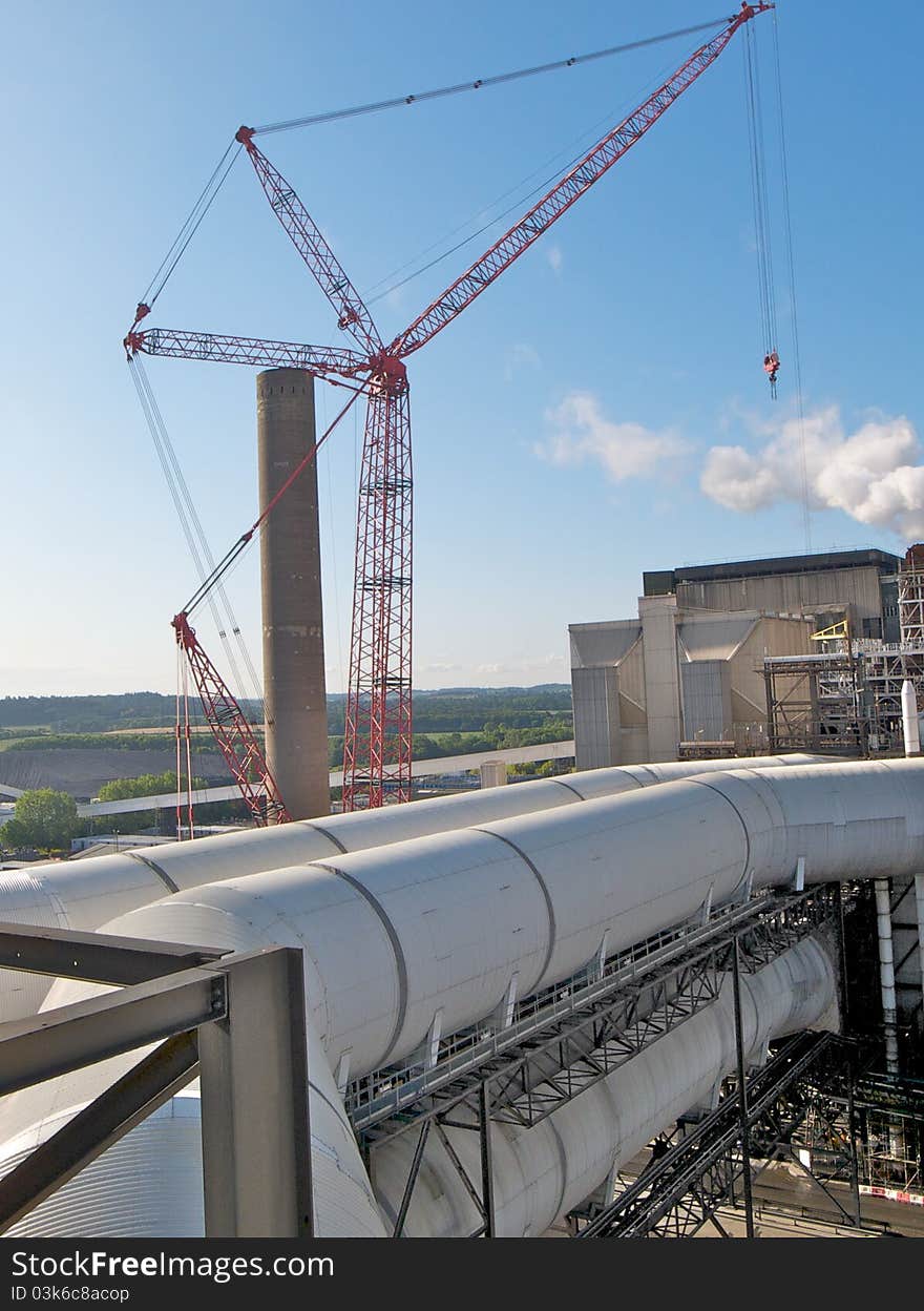 Coal fired power station with crane on site for maintenance projects