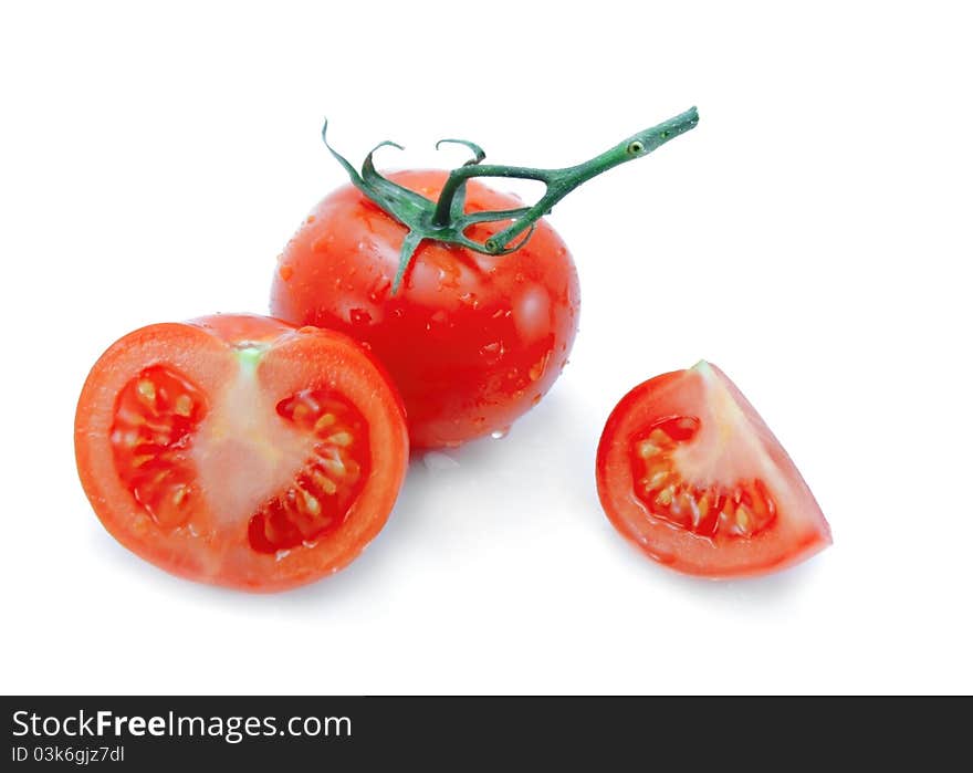 Tomato, half and quarter isolated on a white background