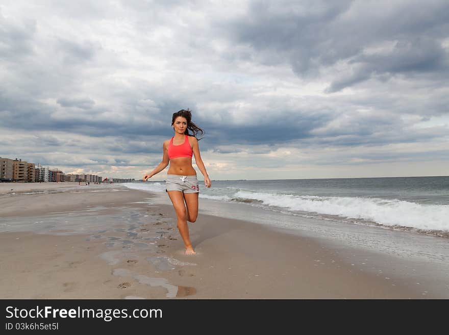 Young female running on the beach