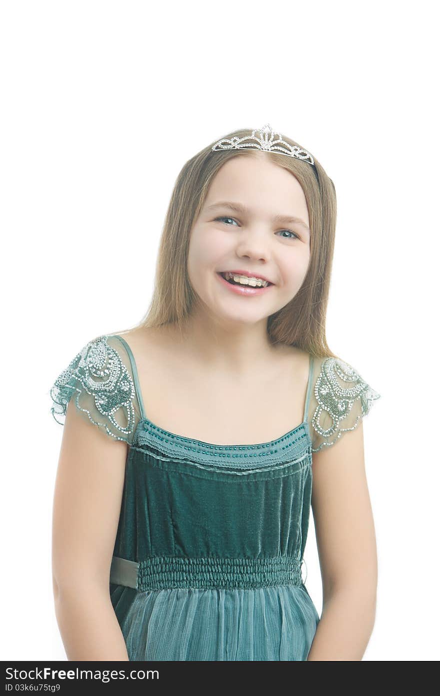 Young little kid in long dress wearing artistic crown and isolated over white background. Young little kid in long dress wearing artistic crown and isolated over white background