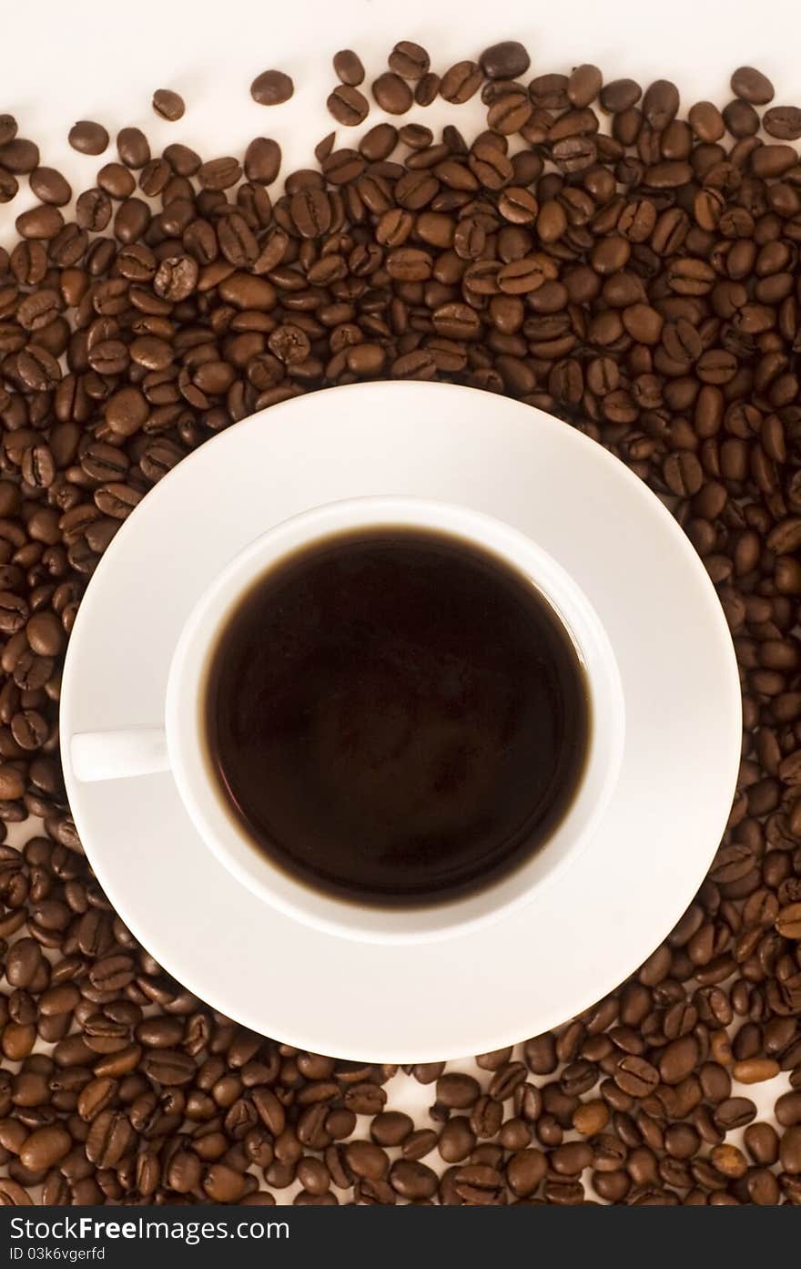 Cup of coffee and coffee beans