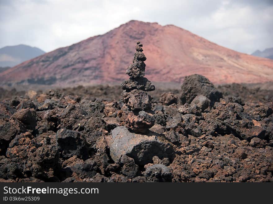 Balanced stone pile with mountain background, lanzarote, canary islands. Balanced stone pile with mountain background, lanzarote, canary islands