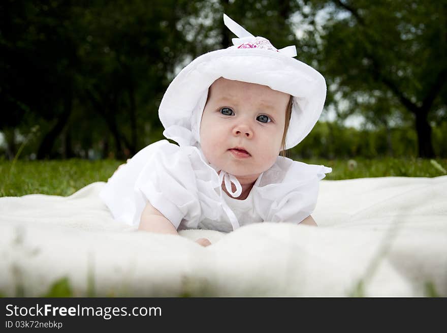 The portrait of the baby in park. The portrait of the baby in park