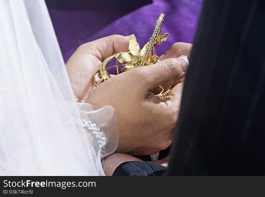 Arras and 13 coins symbolizing the groom's promise to his bride to suport her and their family