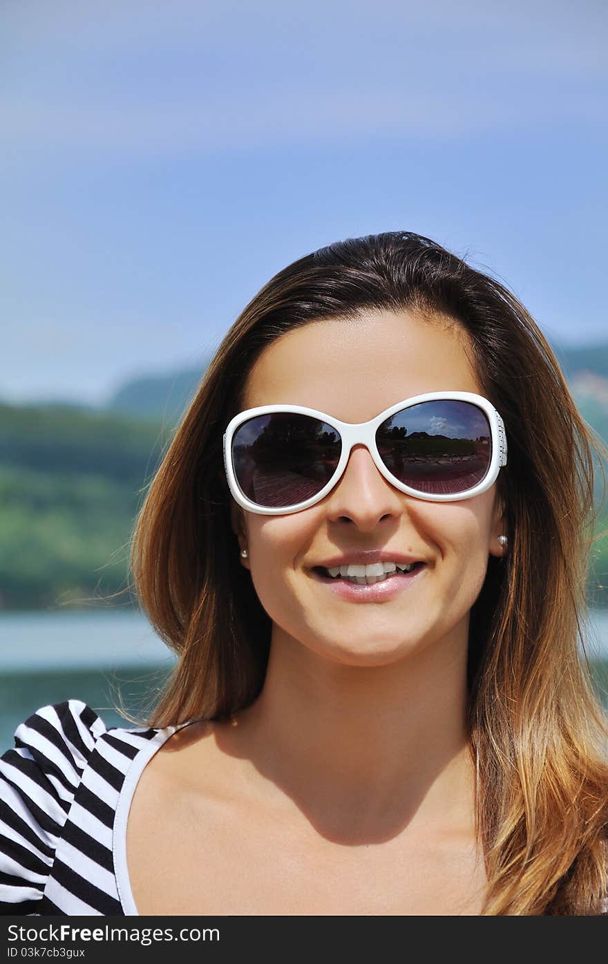 Attractive woman portrait on the lake