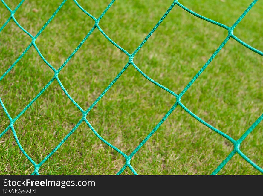 Net soccer goal against the stadium turf. Net soccer goal against the stadium turf