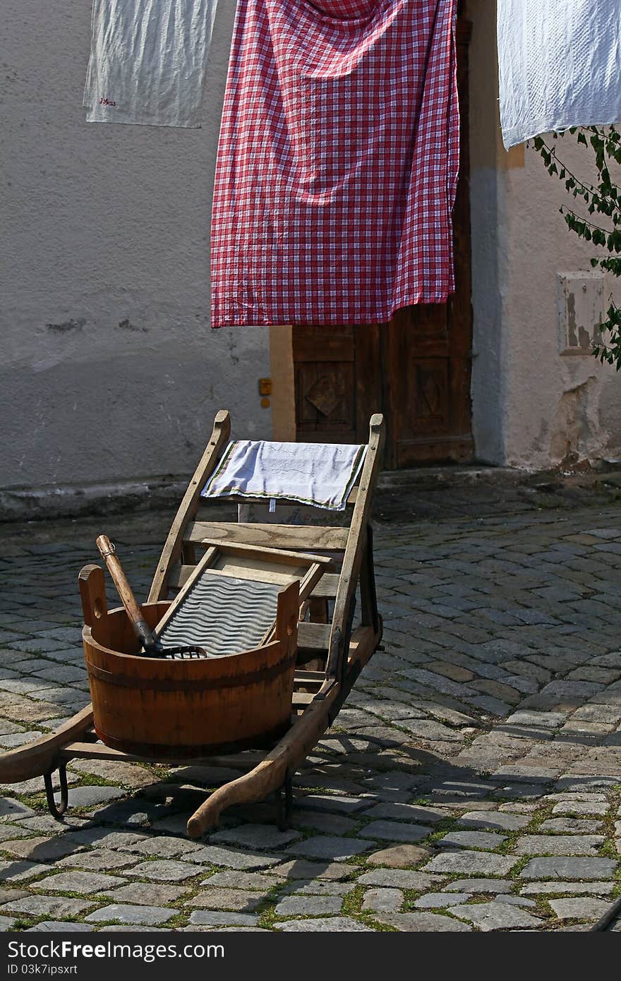 Antique washing trough and wheelbarrow on the market place