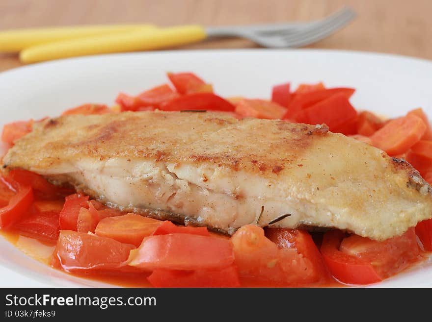 Fried flounder with vegetables