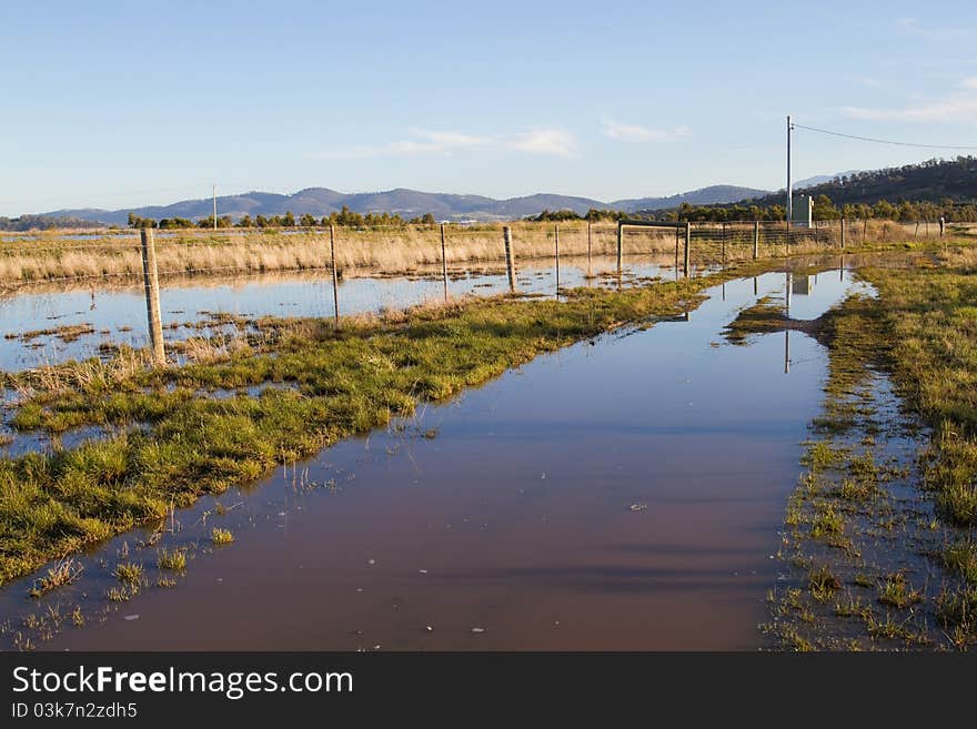 After heavy rains, this meadow in rural Tasmania is flooded.