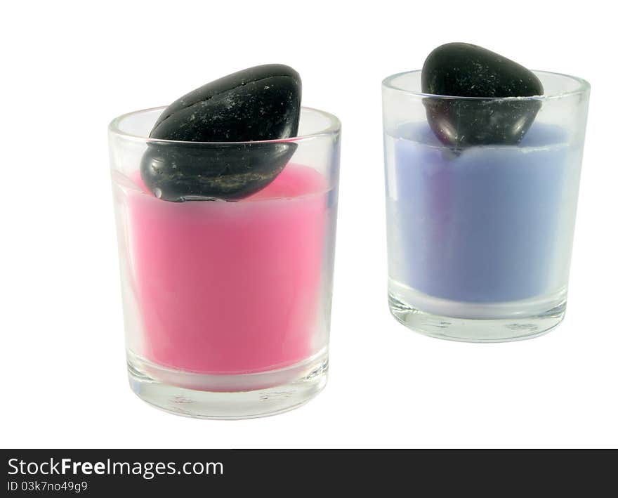 Two candles with black stones. Two candles with black stones