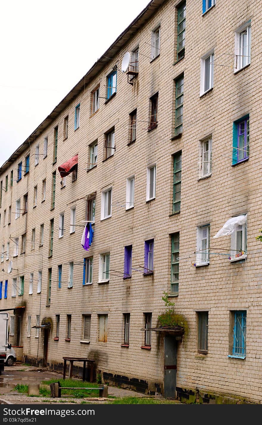 Multi-storey building of the old white brick house