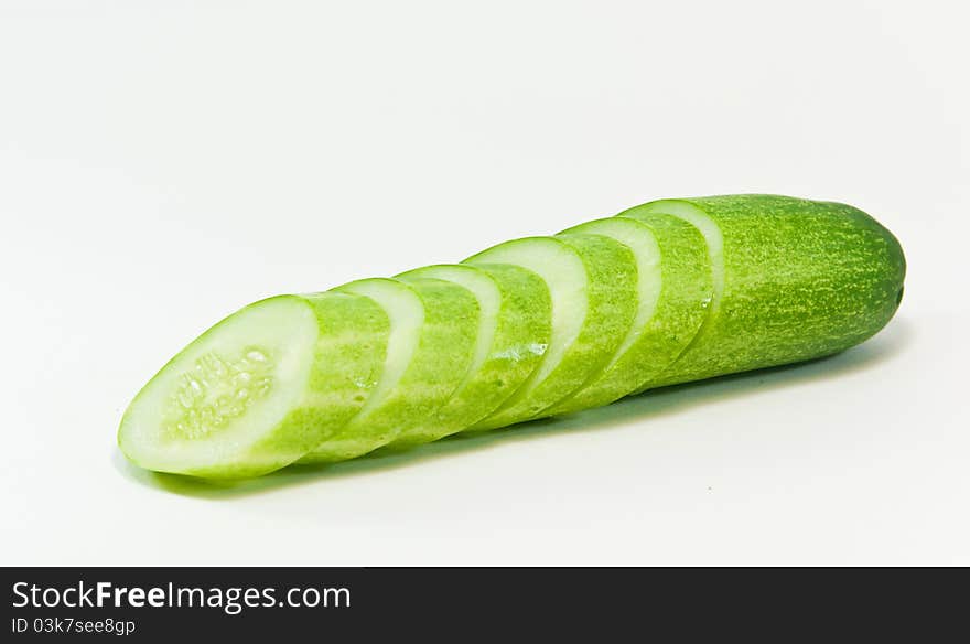 Cucumber and slices isolated on white background. Cucumber and slices isolated on white background.