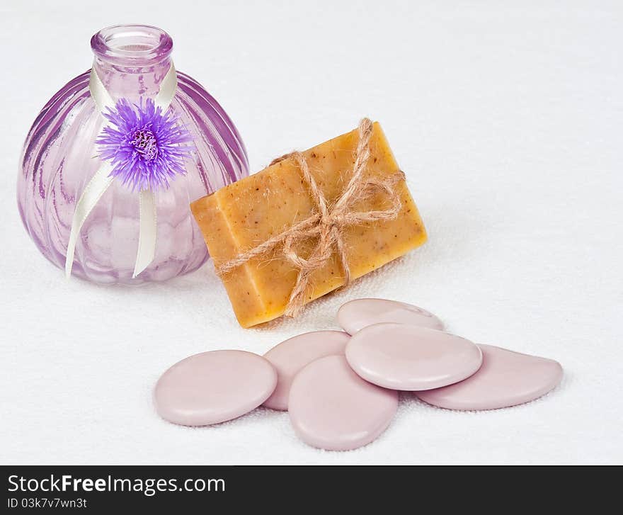 Bar of herbal soap with stones and a vase. Bar of herbal soap with stones and a vase