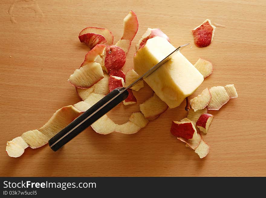 Slices of apple with black knife