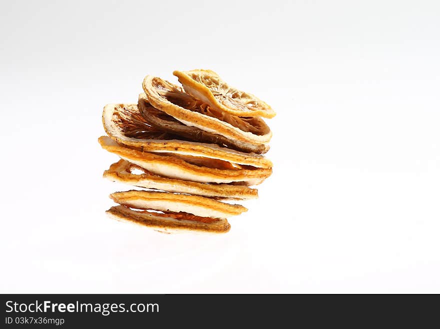 Desiccated citrus slice on white background. Desiccated citrus slice on white background