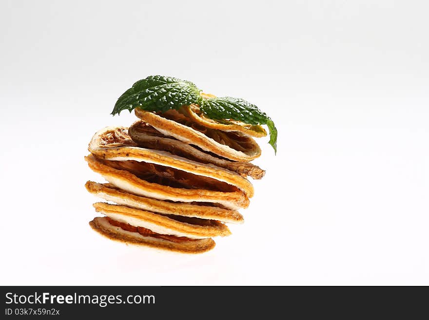 Desiccated citrus slice on white background. Desiccated citrus slice on white background