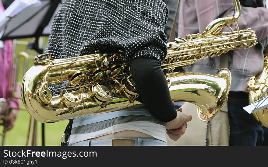 The musician with a Baritone saxophone