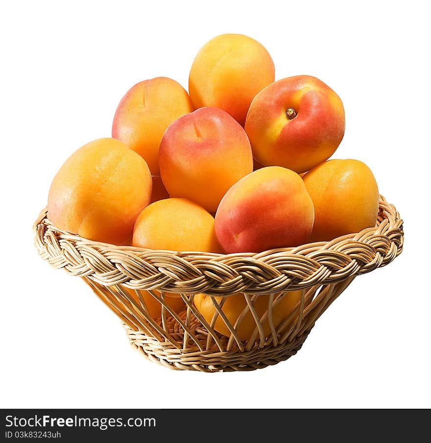 Wooden basket full of apricots