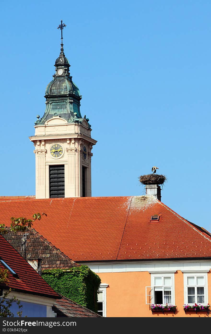 Town Rust / Austria - stork in a nest, church tower