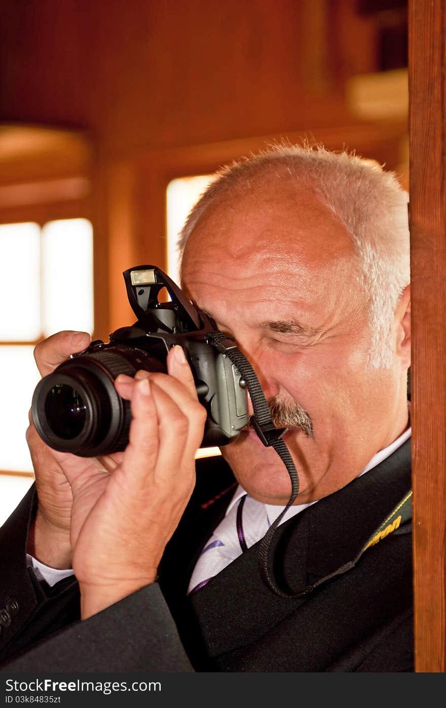 Photographer taking a picture in the interior.