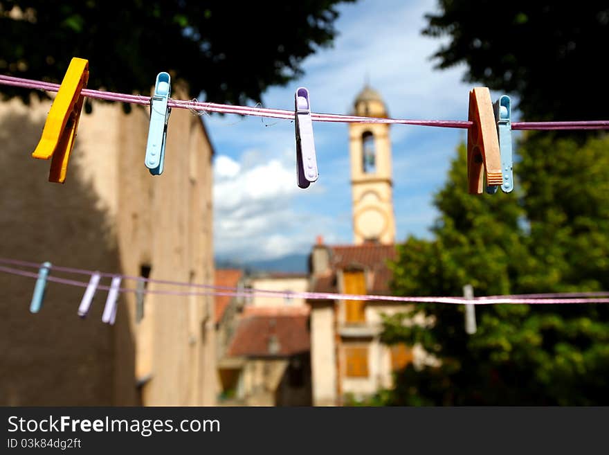 Clothes pegs on clothes line with church