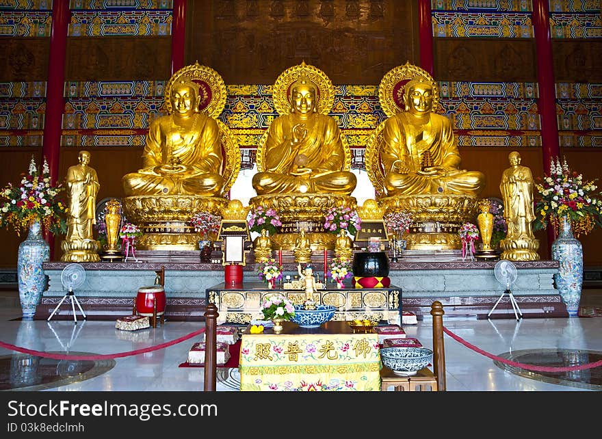 Three Chinese Buddha statues in temple