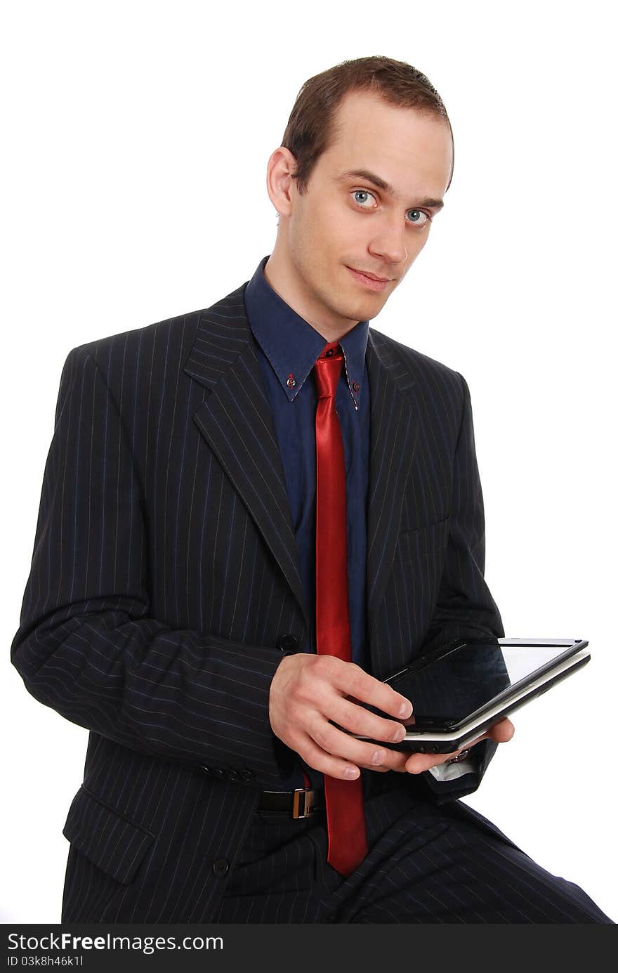 The young enterprising man with the laptop isolated on a white b