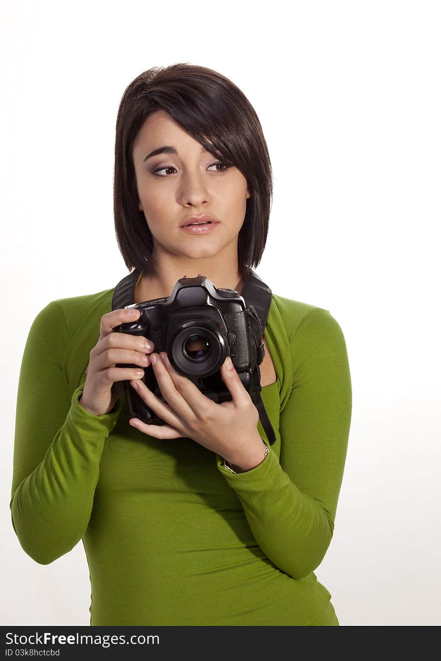 Gorgeous young photographer holding a slr digital camera. Gorgeous young photographer holding a slr digital camera.