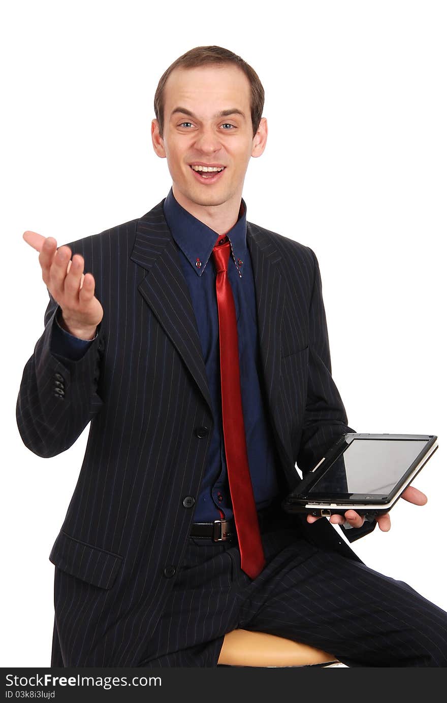 The young enterprising man with the laptop isolated on a white b