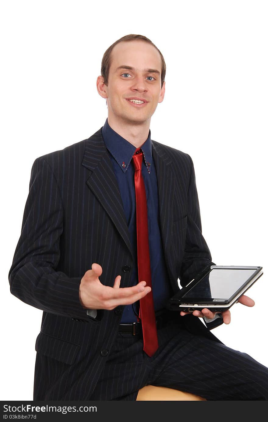 The young enterprising man with the laptop isolated on a white b