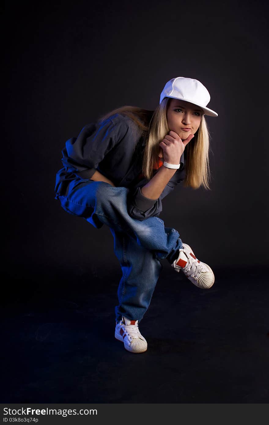 Modern dance, hip hop girl dancer on a black background. Modern dance, hip hop girl dancer on a black background.