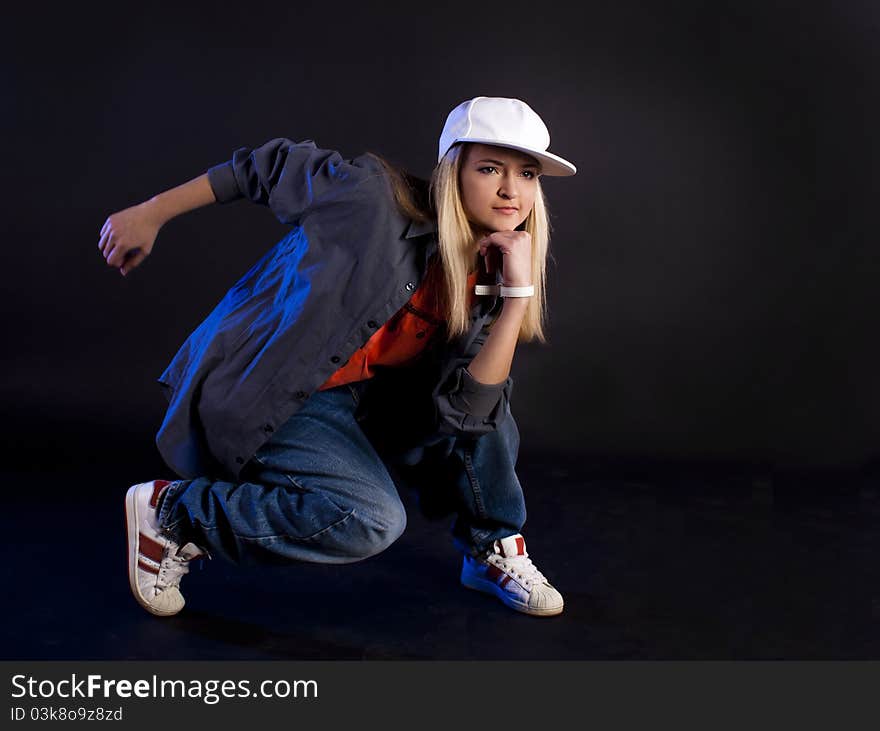 Modern dance, hip hop girl dancer on a black background. Modern dance, hip hop girl dancer on a black background.