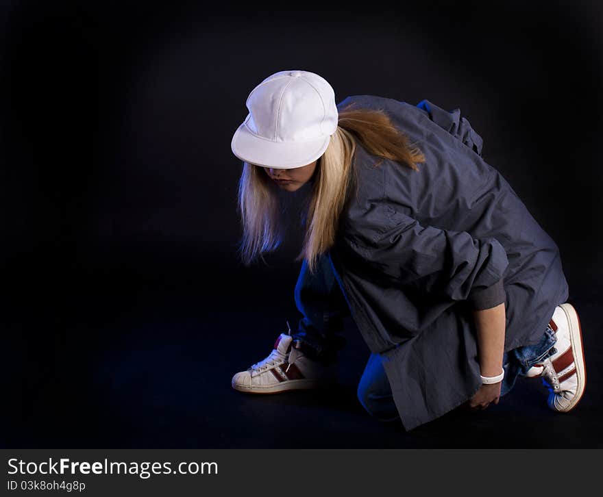 Modern dance, hip hop girl dancer on a black background. Modern dance, hip hop girl dancer on a black background.