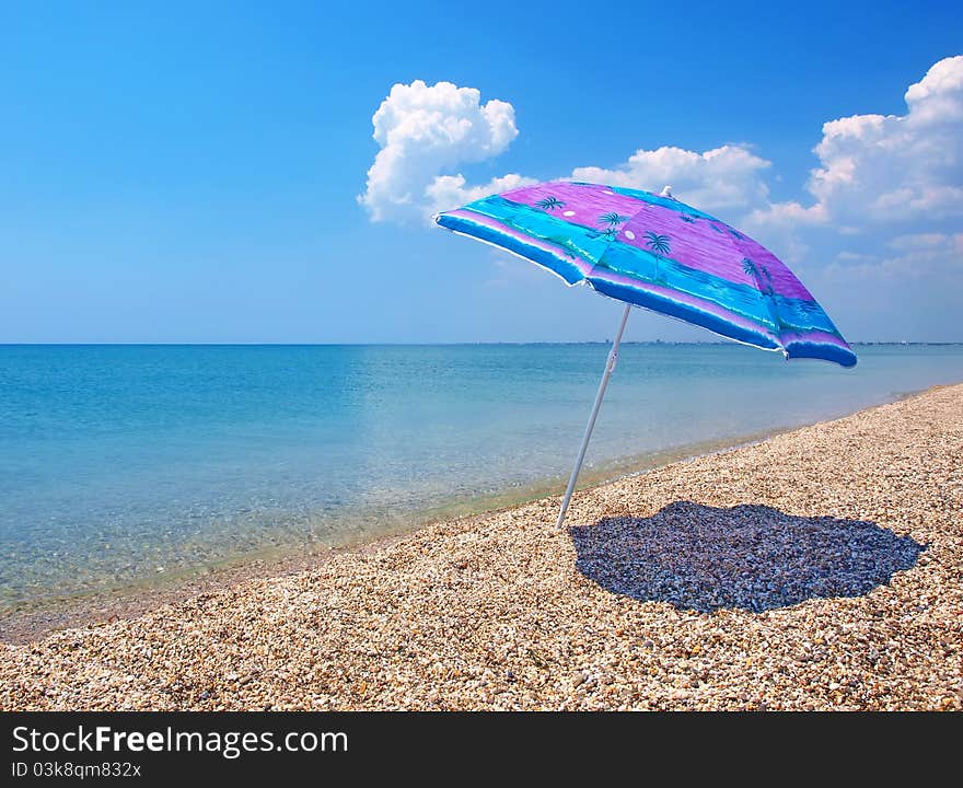 Beach umbrella, sea and sky