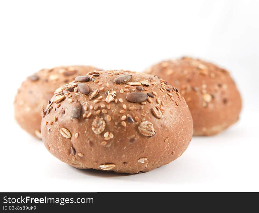 Seeds roll. Two buns on the white background. Seeds roll. Two buns on the white background