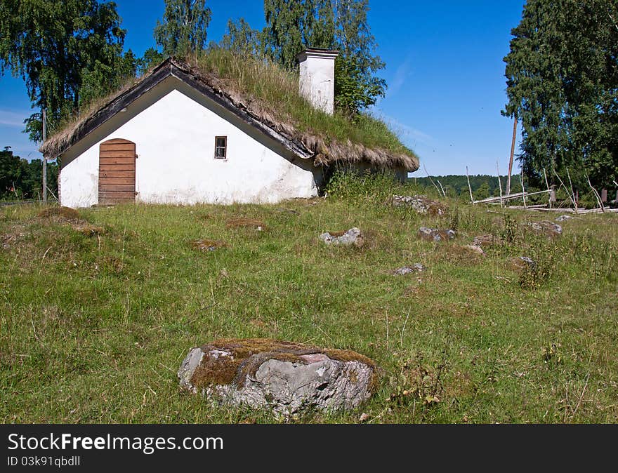 Abandoned cottage with grass on the floor. Abandoned cottage with grass on the floor.