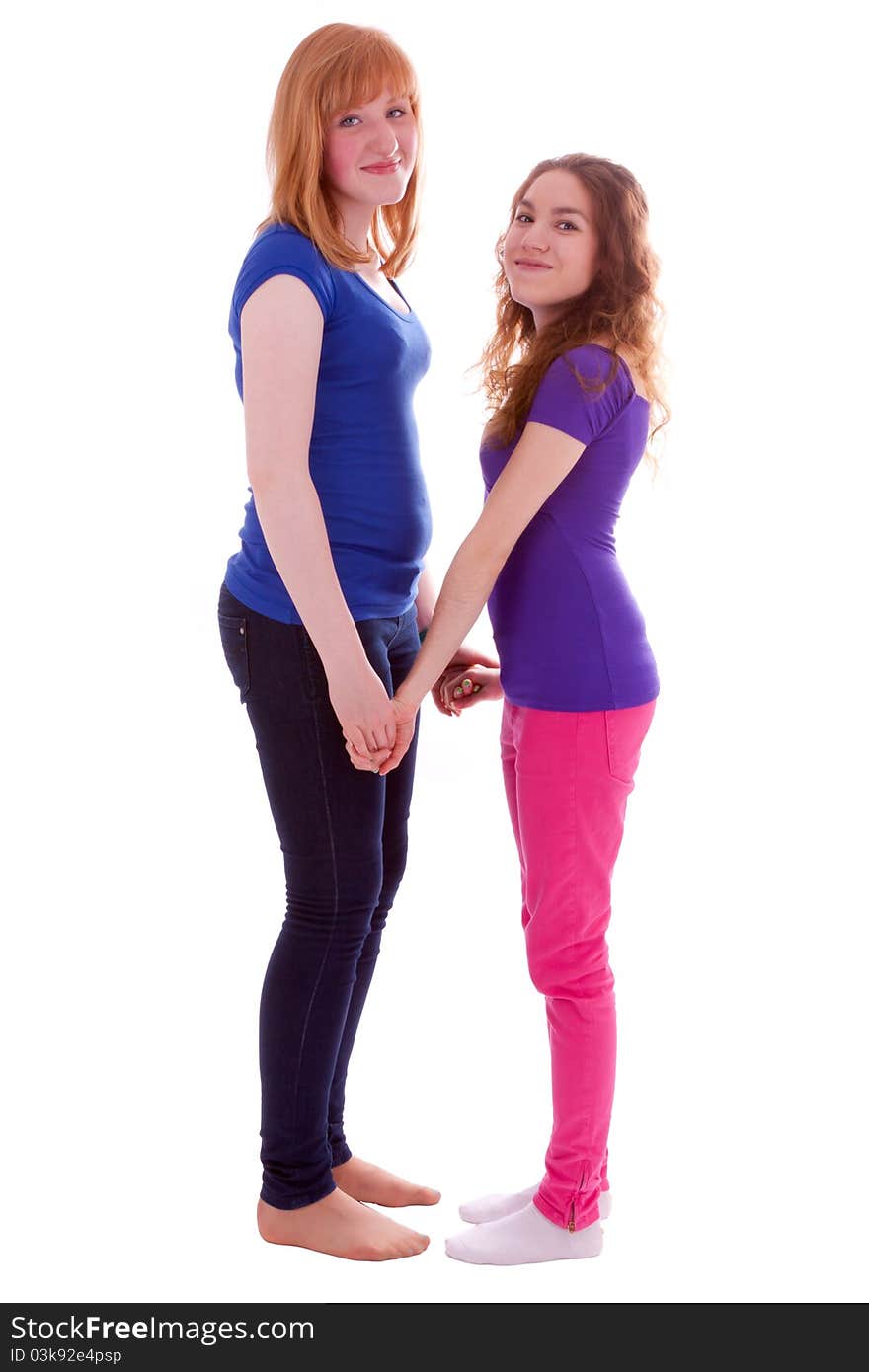 Two young friends standing at close quarters. Two young friends standing at close quarters