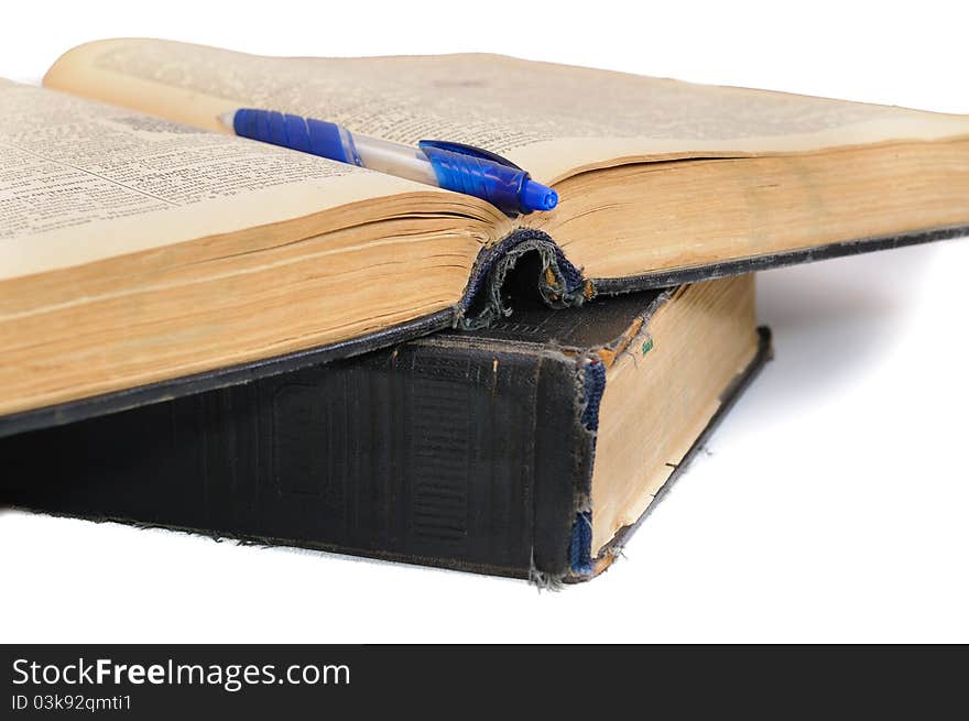 The oldest book and pencil. Isolated on white background