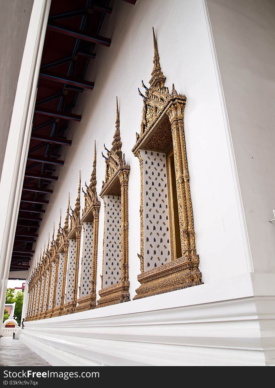 The side Window of Ubosot of Wat Suthat Thepphawararam temple in Bangkok , Thailand (vertical). The side Window of Ubosot of Wat Suthat Thepphawararam temple in Bangkok , Thailand (vertical)