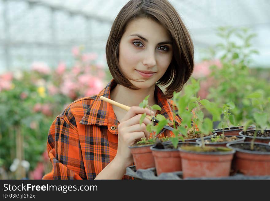 Girl in a greenhouse