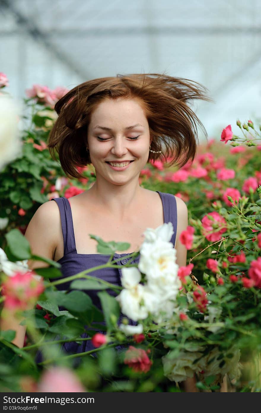 An image of a young lady in the garden. An image of a young lady in the garden