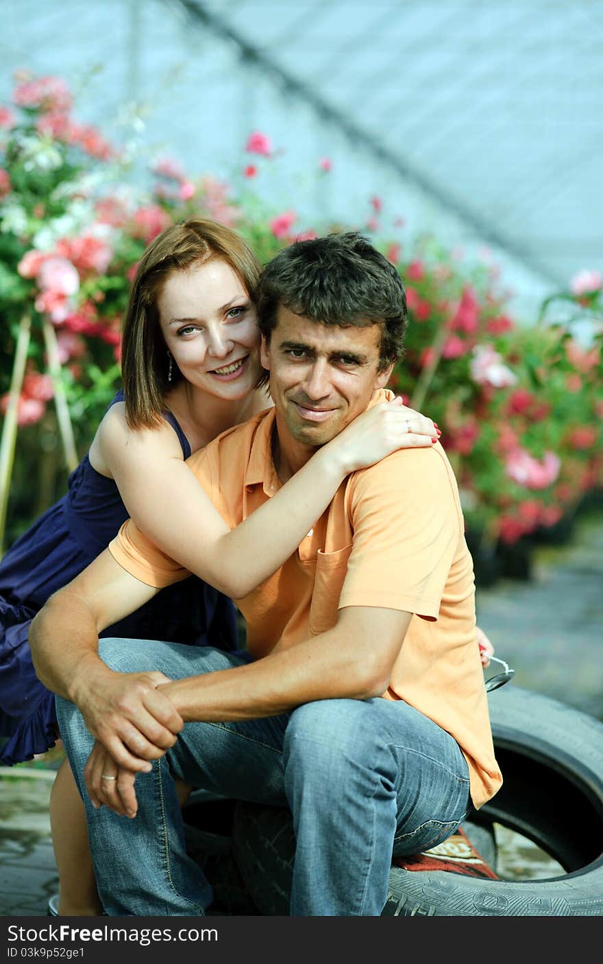 An image of a young couple in a greenhouse