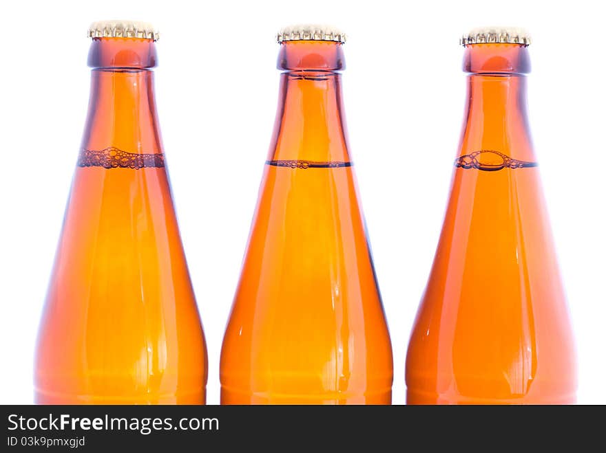 Three beer bottles isolated on white