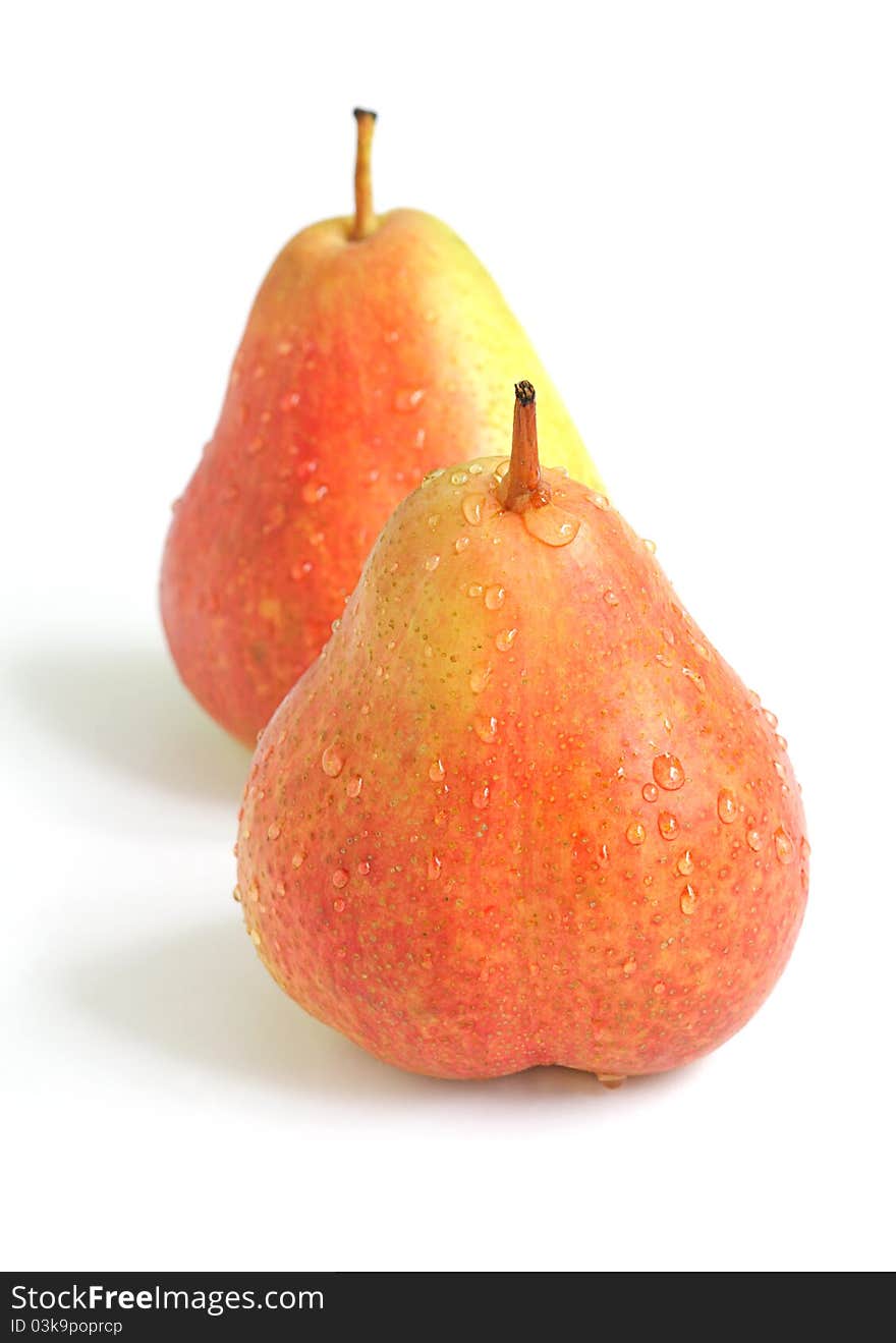 Lovely ripe fresh forelle fruit covered with water droplets on white background. Lovely ripe fresh forelle fruit covered with water droplets on white background