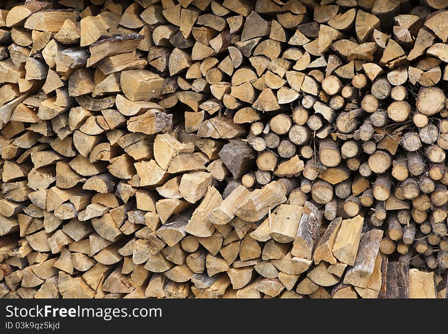 Stacked firewood of birch and pine