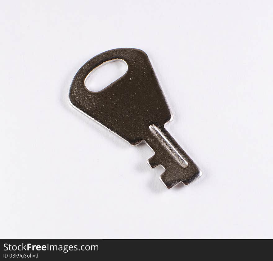 Small key on white background