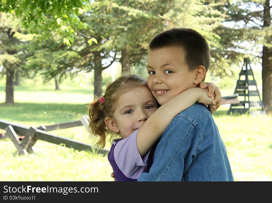 Little boy and little girl hugging